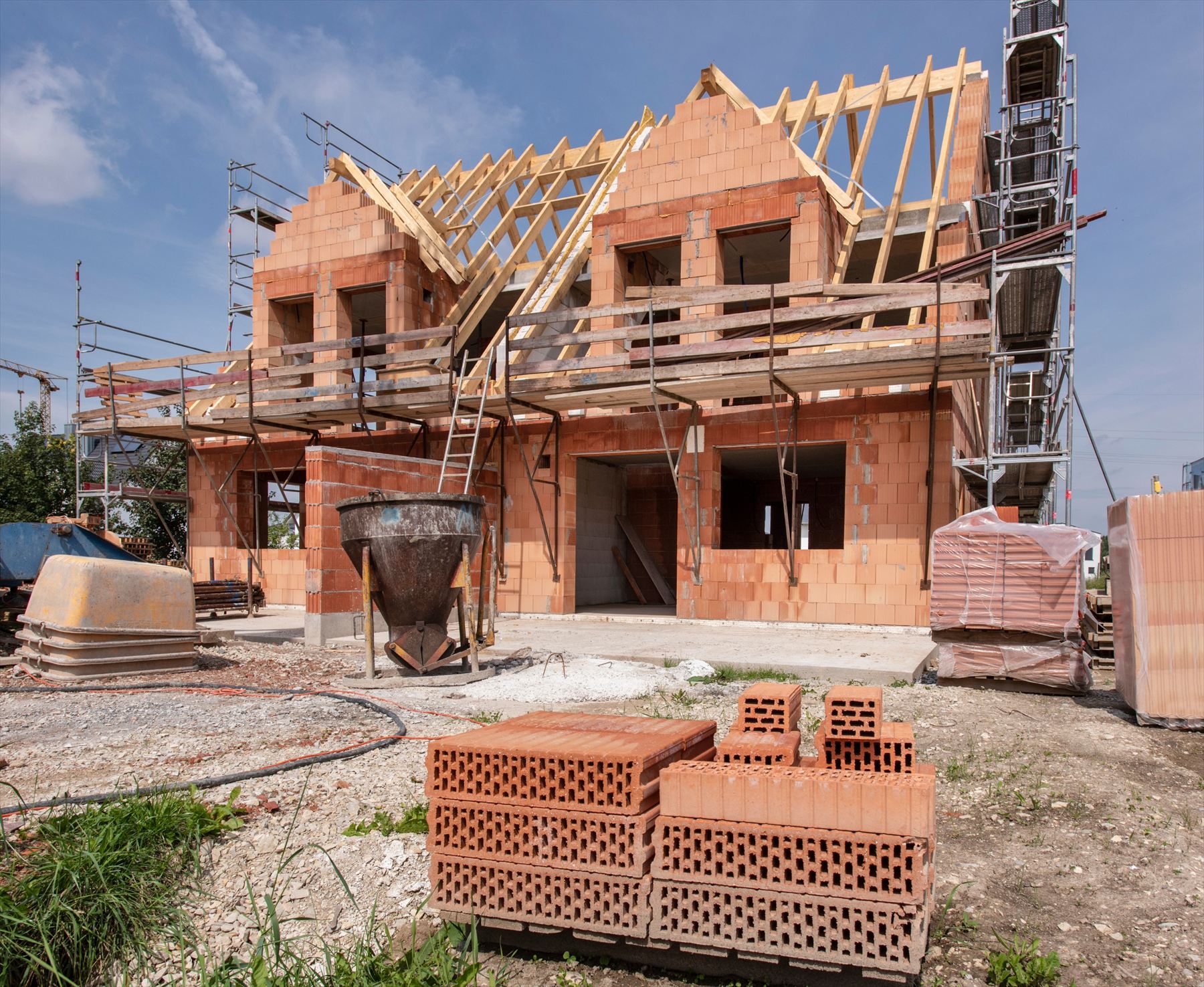 Timber roof frame on a new brick extension