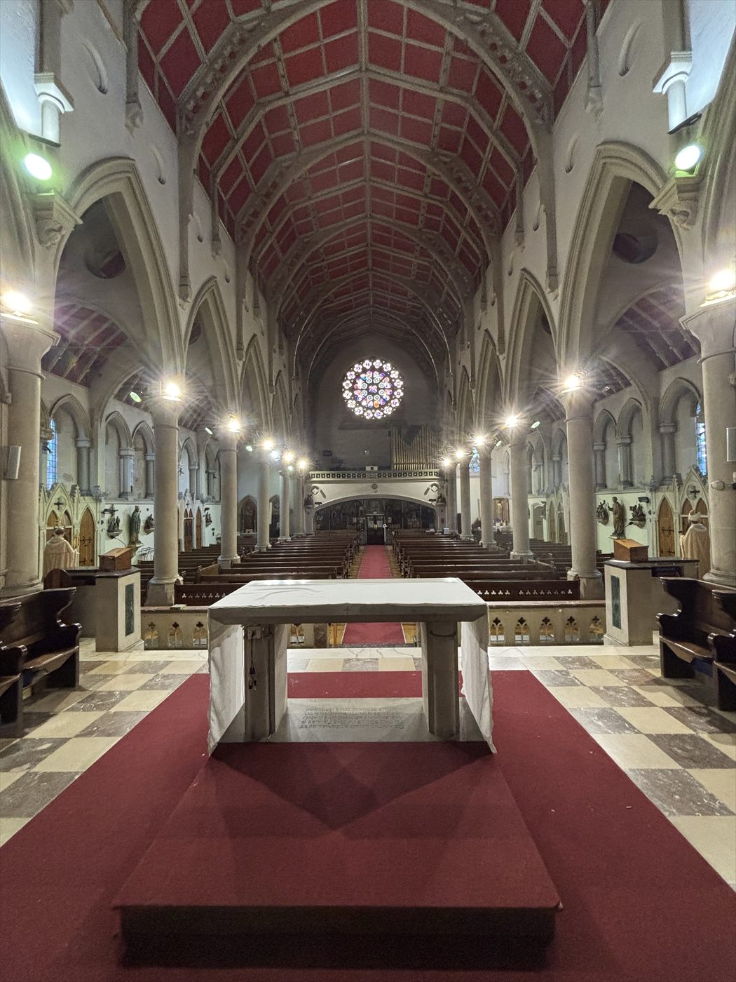The same church nave with new feature lighting installed along both side aisles